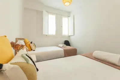 Cama o camas de una habitación en Alhondiga Central Suite By Valcambre