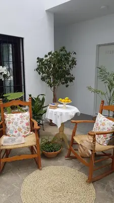 Zona de estar de Alojamiento Las Palmeras
