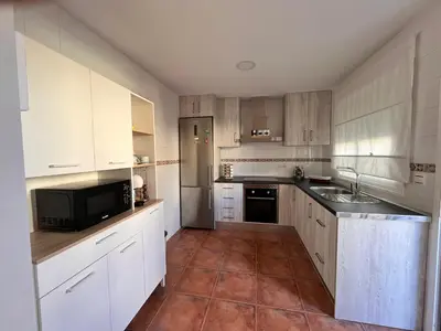 Una cocina o zona de cocina en Casa con piscina en Málaga