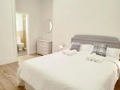 Cama o camas de una habitación en NUEVO RIBERA Arcangel Suite
