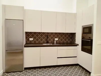 Una cocina o zona de cocina en NUEVO RIBERA Arcangel Suite