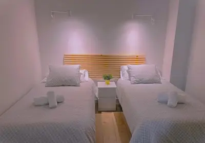 Cama o camas de una habitación en NUEVO RIBERA Arcangel Suite