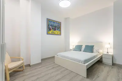 Cama o camas de una habitación en Feria de Abril de Sevilla