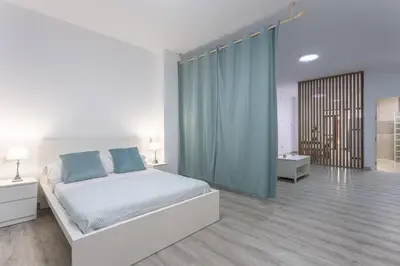 Cama o camas de una habitación en Feria de Abril de Sevilla