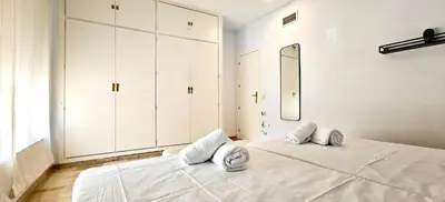 Cama o camas de una habitación en Suite Deluxe Puerta de Almodóvar