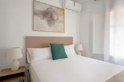 Cama o camas de una habitación en Magno Apartments González Cuadrado