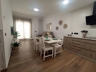 Una televisión o centro de entretenimiento en Apartamento nuevo céntrico con Aparcamiento privado Incluido