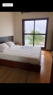 Cama o camas de una habitación en Casa con espectaculares vistas a Sevilla