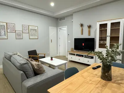 Una televisión o centro de entretenimiento en Apartamento Enira 80