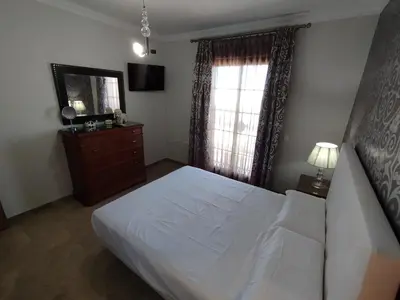 Cama o camas de una habitación en Adosado Centro Urbano 3 Dorm Patio Terraza Wi-fi Puente Genil 1-6 Huésped