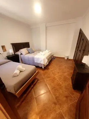 Cama o camas de una habitación en Casa rural Paqui