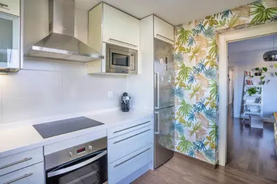 Una cocina o zona de cocina en Ático La Muralla con terraza privada