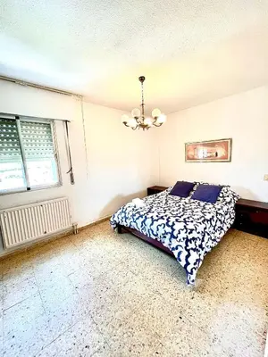 Cama o camas de una habitación en Espacioso piso en Puertollano