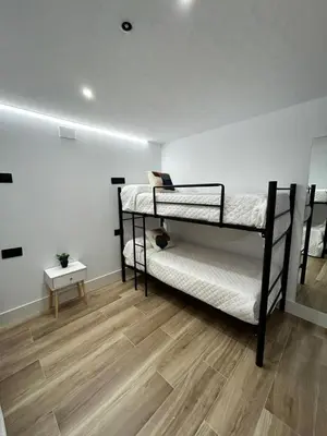 Cama o camas de una habitación en BAJO A habitación con literas Apartamentos JUAN ROBLEDO Centro Ciudad