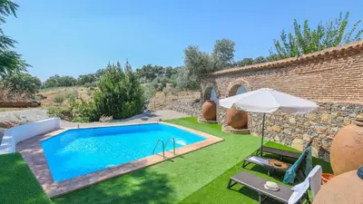 Piscina en o cerca de Cortijo San Rafael Constantina by Ruralidays
