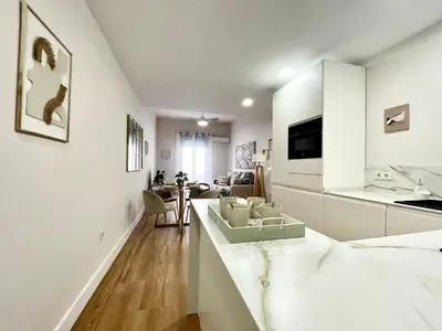 Una televisión o centro de entretenimiento en House in City Garden 3
