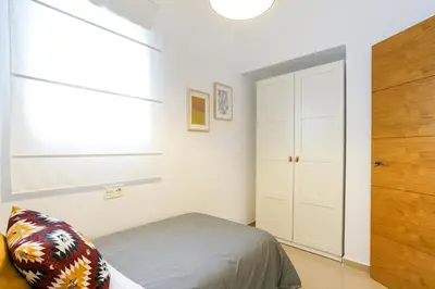 Cama o camas de una habitación en Apartamentos Diaber San Leandro