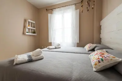 Cama o camas de una habitación en DREAM Sevilla Apartment, charming in the center