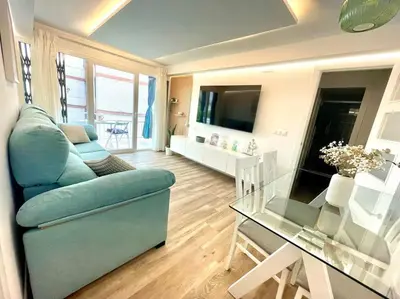 Una televisión o centro de entretenimiento en Geysotur Suite Santa Rosa
