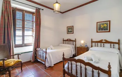 Cama o camas de una habitación en 10 Bedroom Stunning Home In Santaella