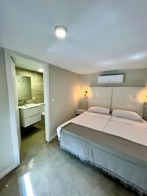 Cama o camas de una habitación en Ribera Suites GP