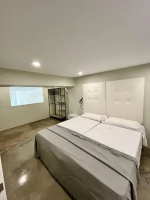 Cama o camas de una habitación en Ribera Suites GP