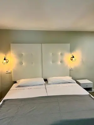 Cama o camas de una habitación en Ribera Suites GP