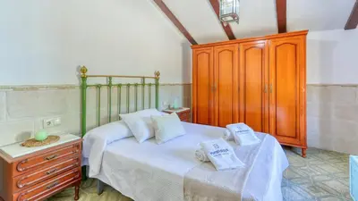 Cama o camas de una habitación en Cortijo San León Fuente de Piedra by Ruralidays