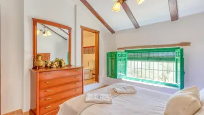 Cama o camas de una habitación en Cortijo San León Fuente de Piedra by Ruralidays