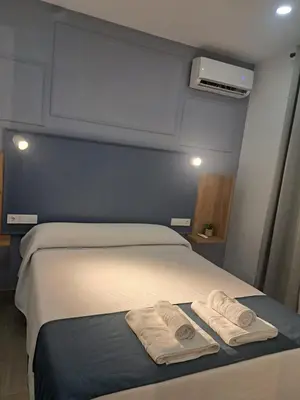 Cama o camas de una habitación en ALOJAMIENTOS EL LUGARILLO 1ºa
