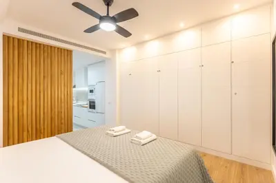 Cama o camas de una habitación en Bernaldez Suite - Vacacional Sevilla