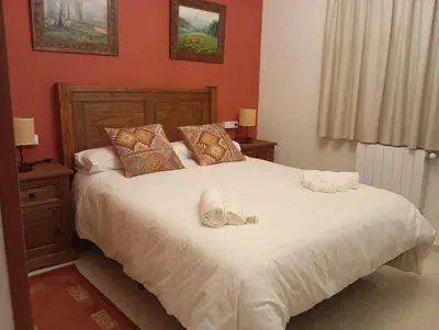 Cama o camas de una habitación en Casa Rural Río Frío