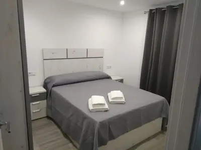 Cama o camas de una habitación en apartamento nuevo