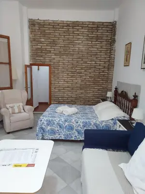 Cama o camas de una habitación en Patio Sevillano Flores