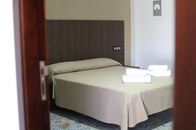 Cama o camas de una habitación en Hospedium DLJ Hostal La Paz