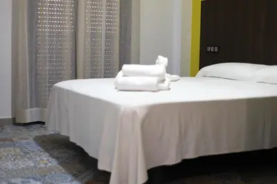 Cama o camas de una habitación en Hospedium DLJ Hostal La Paz