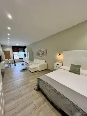 Cama o camas de una habitación en Califa SuitesGP 5