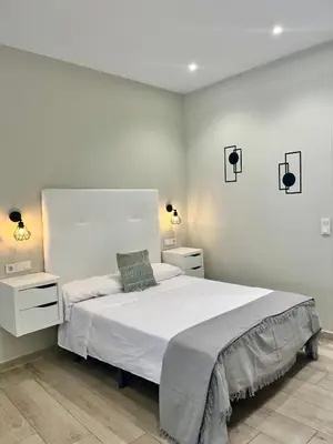 Cama o camas de una habitación en Califa SuitesGP 5