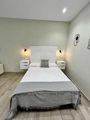 Cama o camas de una habitación en Califa SuitesGP 5