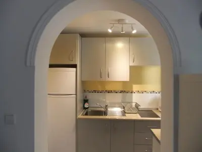 Una cocina o zona de cocina en Cozy and charming house in Sevilla