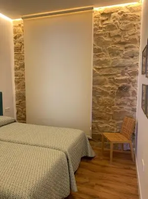 Cama o camas de una habitación en Casa del Párroco
