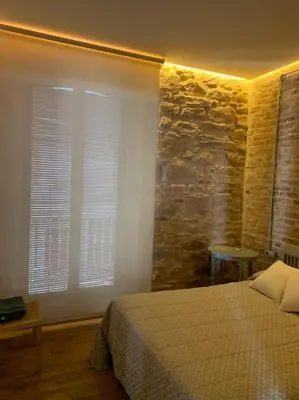Cama o camas de una habitación en Casa del Párroco