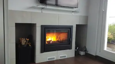 Una televisión o centro de entretenimiento en Casa Caballero de la Rosa