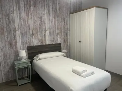 Cama o camas de una habitación en RentalSevilla Cardenal Rodrigo de Castro