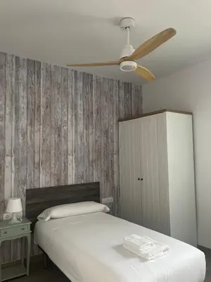 Cama o camas de una habitación en RentalSevilla Cardenal Rodrigo de Castro