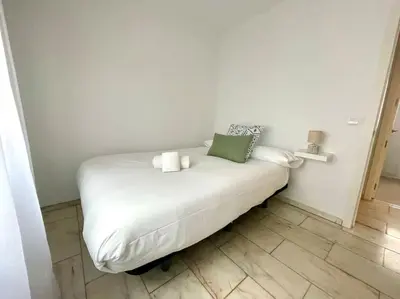 Cama o camas de una habitación en Geysotur Capuchinas parking gratis