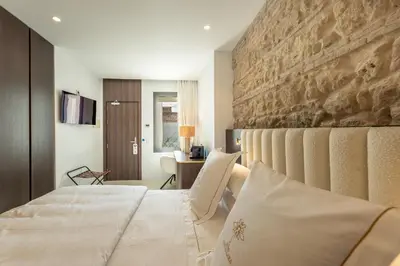 Cama o camas de una habitación en P SANTA CLARA HOTEL BOUTIQUE By Sojo