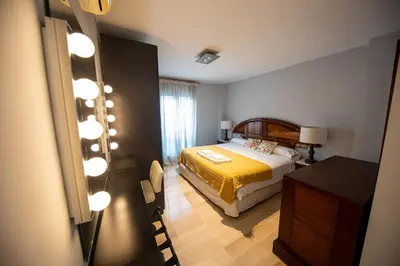 Cama o camas de una habitación en RentitSpain - Jaén - Ático Exlusivo con Balcón Curvo en el Centro