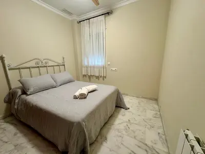 Cama o camas de una habitación en Apartamento en CORAZÓN de CÓRDOBA con PARKING OPCIONAL