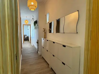 Una televisión o centro de entretenimiento en Apartamento El Patio de Doña Engracia